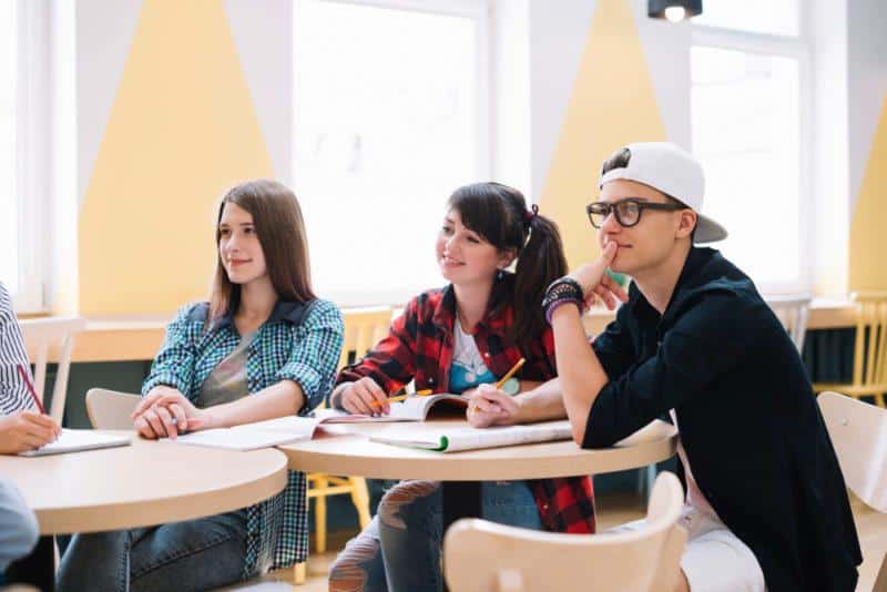 classmates-sitting-learning-desk-800x534